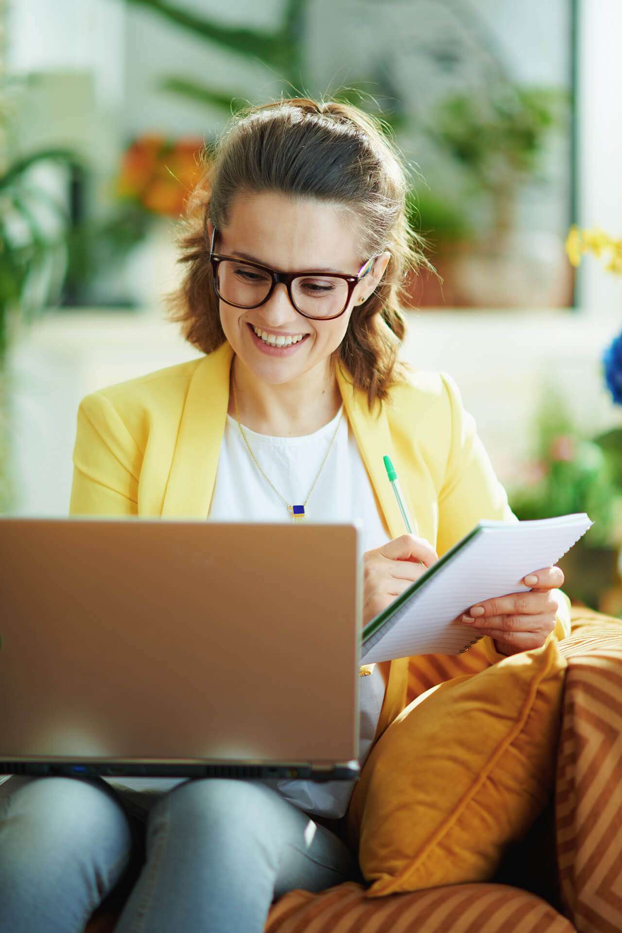 business woman smiling at her laptop
