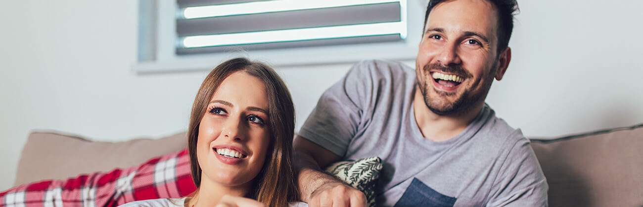 woman and man watching tv
